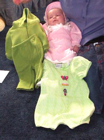 Mary with her new outfits from Mamaw, Aunt Joni & Uncle Bruce.