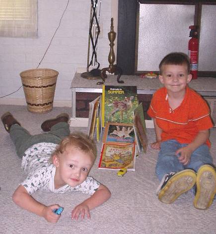 Timothy was proud of his car ramp :)  (of course, Elijah thought he needed in the picture also)
