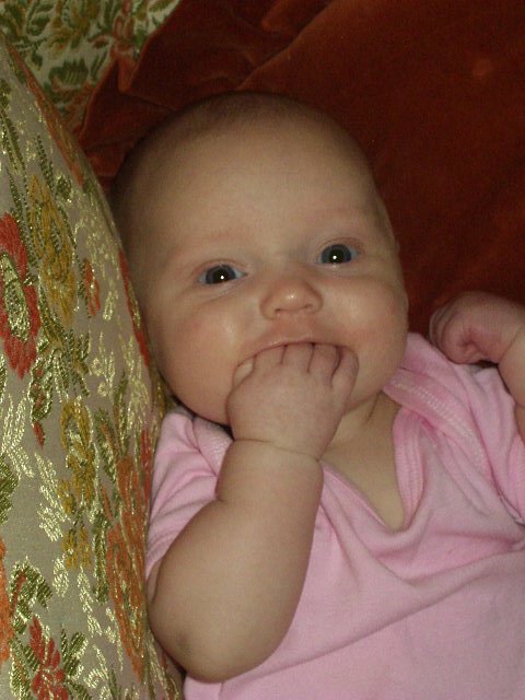 Abigail thinks she is funny because she can fit all of her fingers in her mouth :O