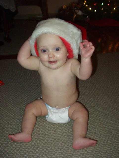 Abigail looks really excited!! That must be Santas hat :)