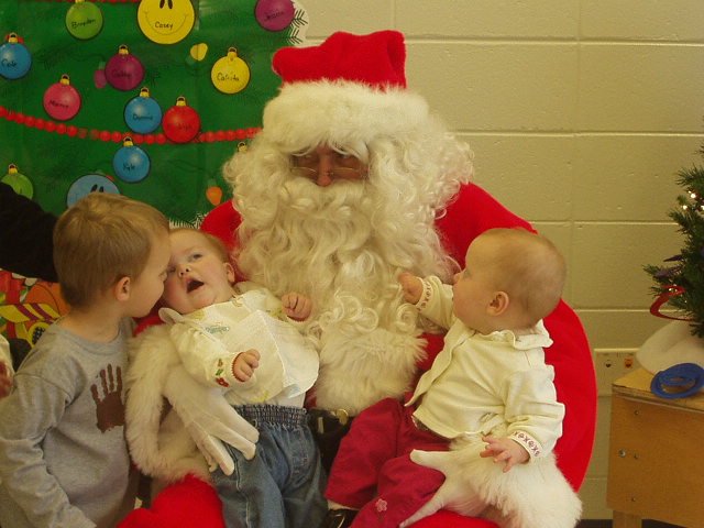 I'm gonna try and pull this beard off...Elijah is telling Mary what to tell Santa she wants :)