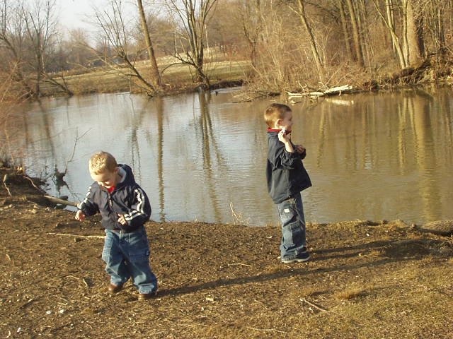 Timothy is feeding the ducks...Elijah is heading back for more food :)