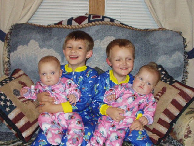 Timothy, Elijah, Mary and Abigail sitting on the couch at Mamaws.