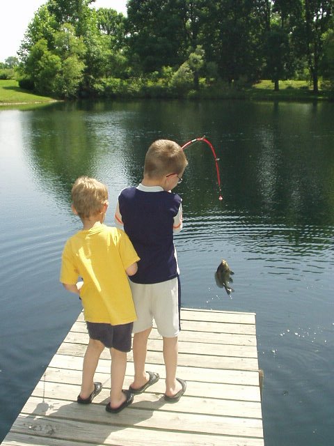 Timothy caught the first fish of the day!!! (check out the pole)