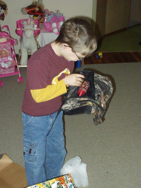A hunting pack and BB's. Timothy thought that he had to wear his camo pack outside to shoot :)