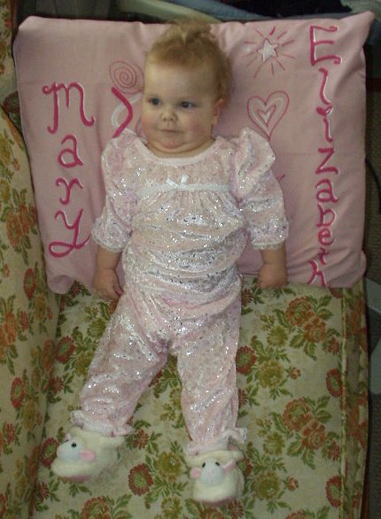 I look so pretty in my outfit and lamb slippers from Mamaw.