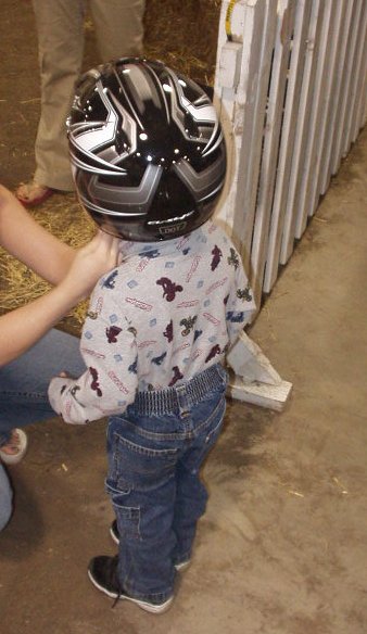 Elijah is getting some help with his helmet! Safety first!