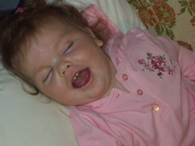 Mary is trying to skip school! I don't believe that she is sleeping! It may be the SMILE!!