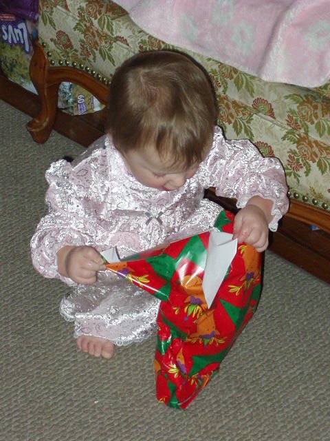 Abigail is excited to see what this gift is :)