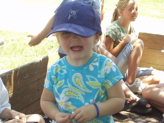 Abigail is excited to ride in the parade!! She also looks cute with Timothy's hat on :)