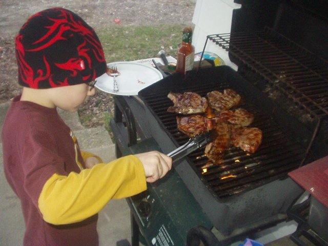 Timothy had to plan and cook an outside meal. We did everything inside, but he grilled bbq chops.. they were great!! (He had so much fun turning the meat)