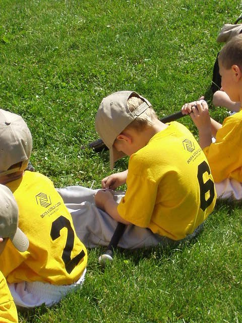 Elijah is the youngest boy on his team. I'm not sure what he's picking at!