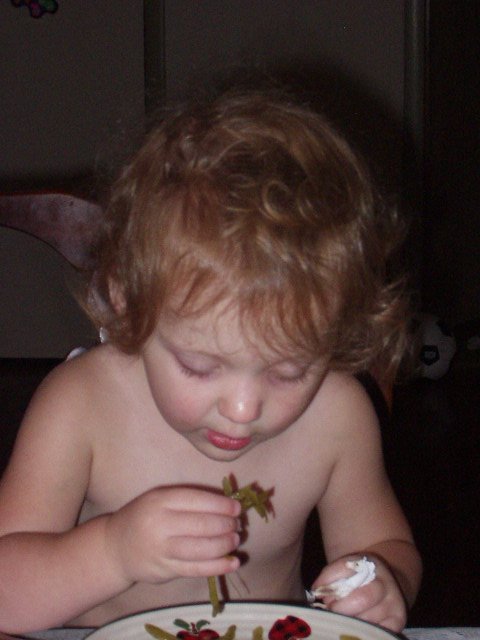 Abigail can't shovel green beans in her mouth fast enough!!