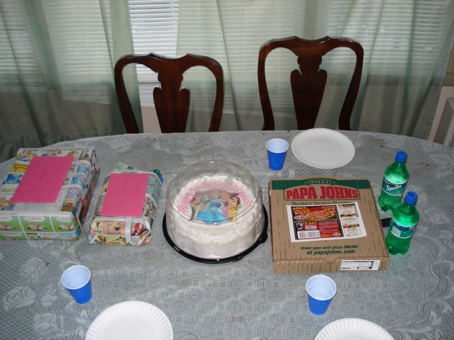 Seconds before our little party got started! This is your typical single dad birthday party spread.  Pizza, soda, cake, and gifts wrapped in comic strips.