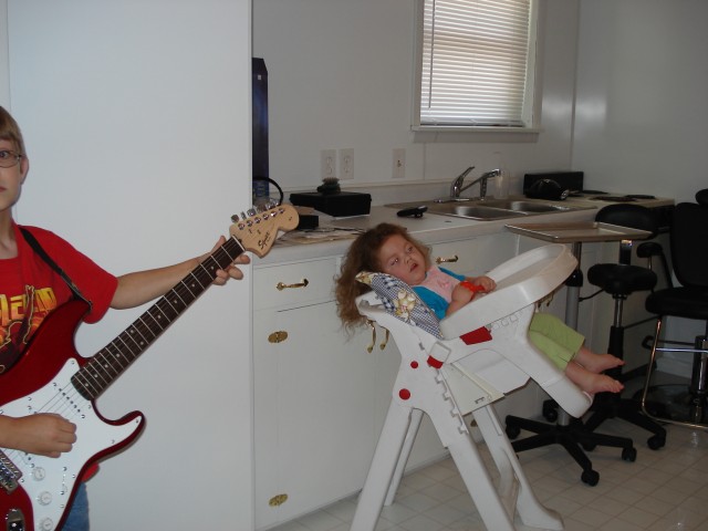 May loves listening to Tim play the gee-tar.