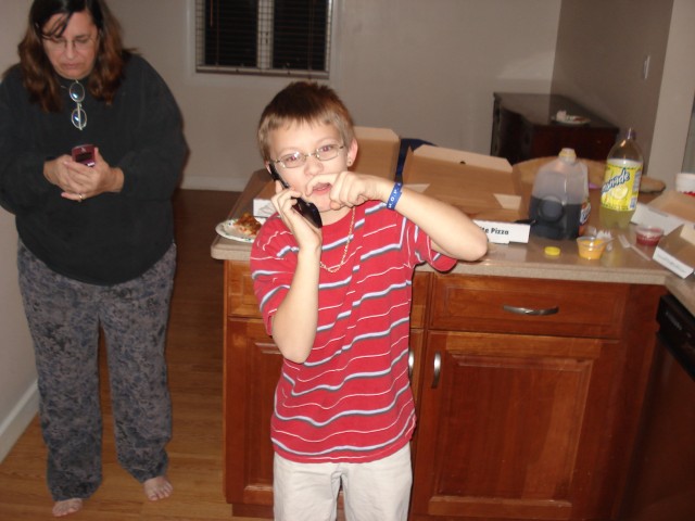 Yes, that is indeed Timmy making a finger mustache and pretending to be a Mexican on his new cell phone.