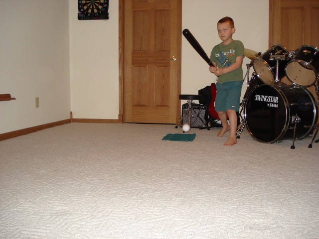Elijah is testing out his pitching machine.