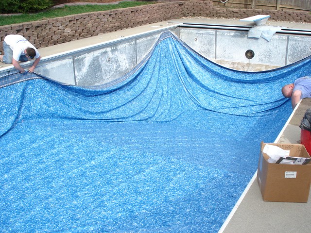 After removing the older liner, the pool dude stretched the new one out.