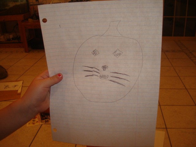 Abby wants a kitty face on her pumpkin!