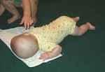 Mary is trying to crawl. You have to look close :)