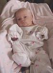 She still doesn't fit into 0-3 month clothes very well :)