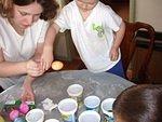 Mommy is helping me put the egg down to dry.