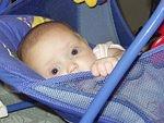 Abigail turned her self around and was trying to crawl out of the swing! I love this picture :)