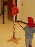 Elijah had to show all of the kids how to hit the piñata! (sorry the pic is blurry)