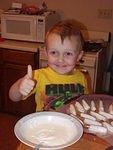 I helped Mommy make little pretzel rods dipped in white chocolate. Soooooo yummy!!