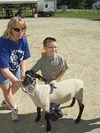 Timothy is showing off his blue ribbon :)
