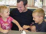 Abigail and Elijah tickle the ice cream out of Kyle!!