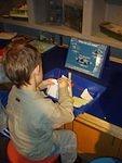 Elijah is building a boat out of misc recycled products :)