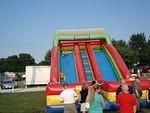 Elijah bounces down the slide.