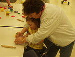Abigail is getting a little help from her teacher :)